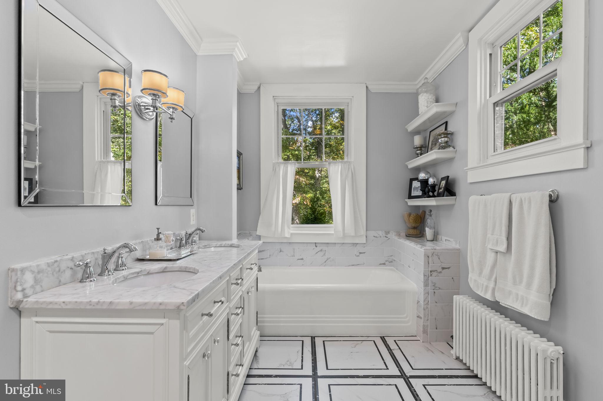 8150 Fairground Road La Plata, MD 20646 - Photo 46 of 100 a bathroom with a granite countertop sink and a large mirror