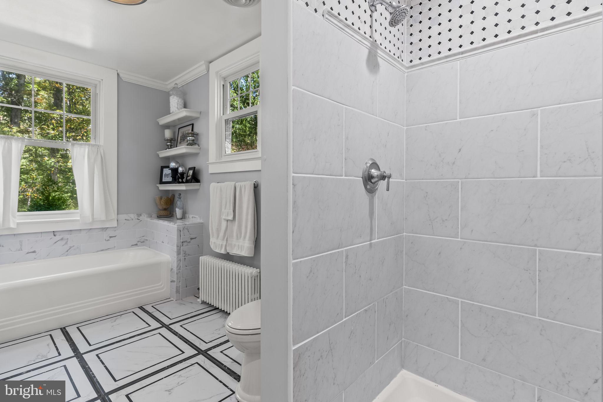 8150 Fairground Road La Plata, MD 20646 - Photo 48 of 100 a bathroom with a bathtub and a shower