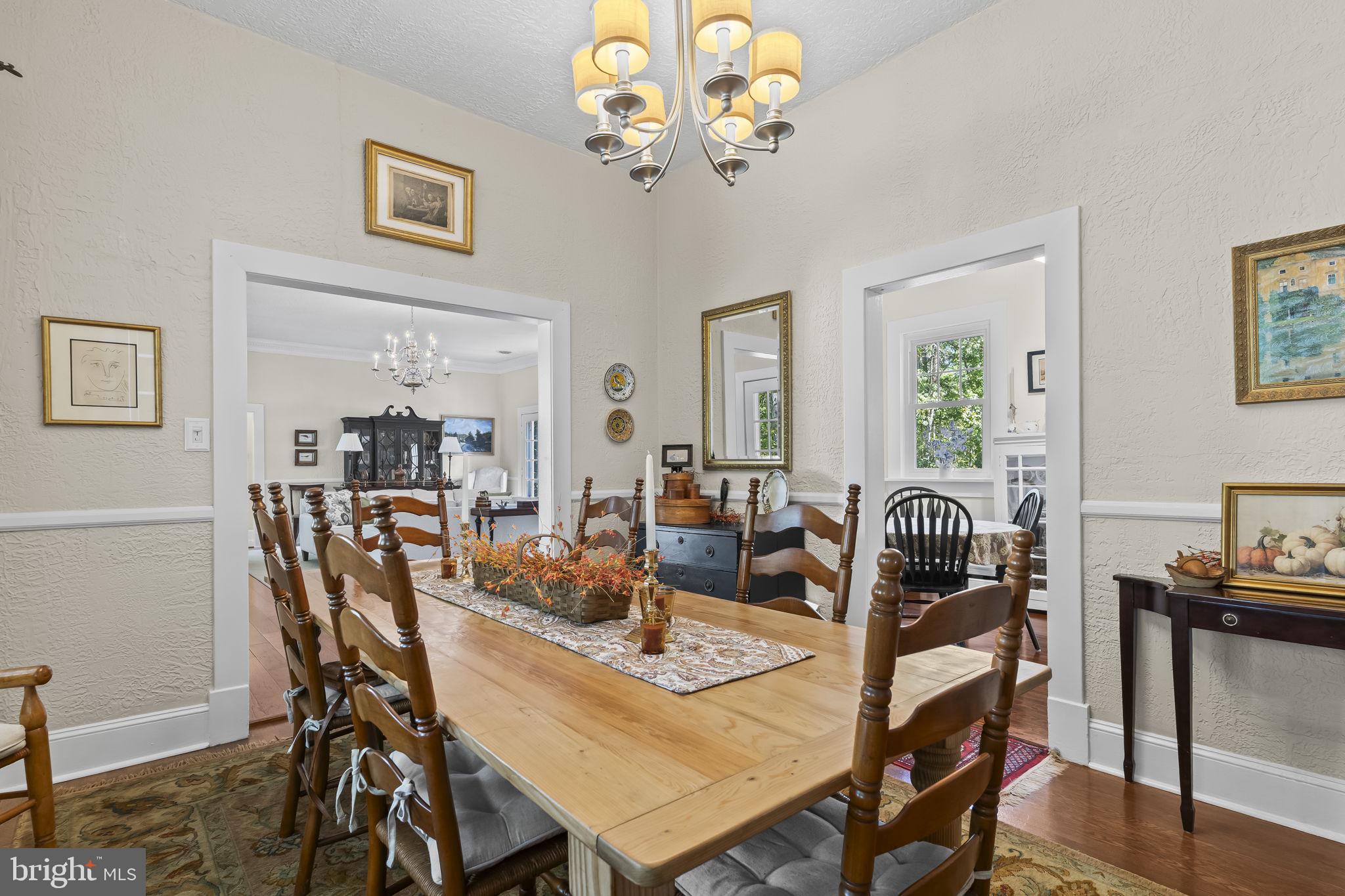 8150 Fairground Road La Plata, MD 20646 - Photo 53 of 100 a view of a dining room with furniture a chandelier and wooden floor