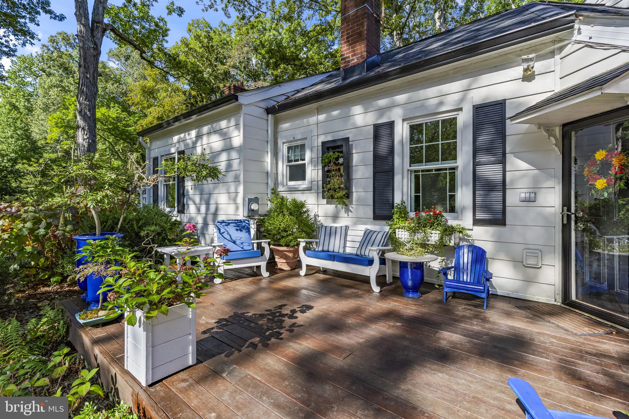 8150 Fairground Road La Plata, MD 20646 - Photo 75 of 100 a view of a chairs and table in a back yard of the house