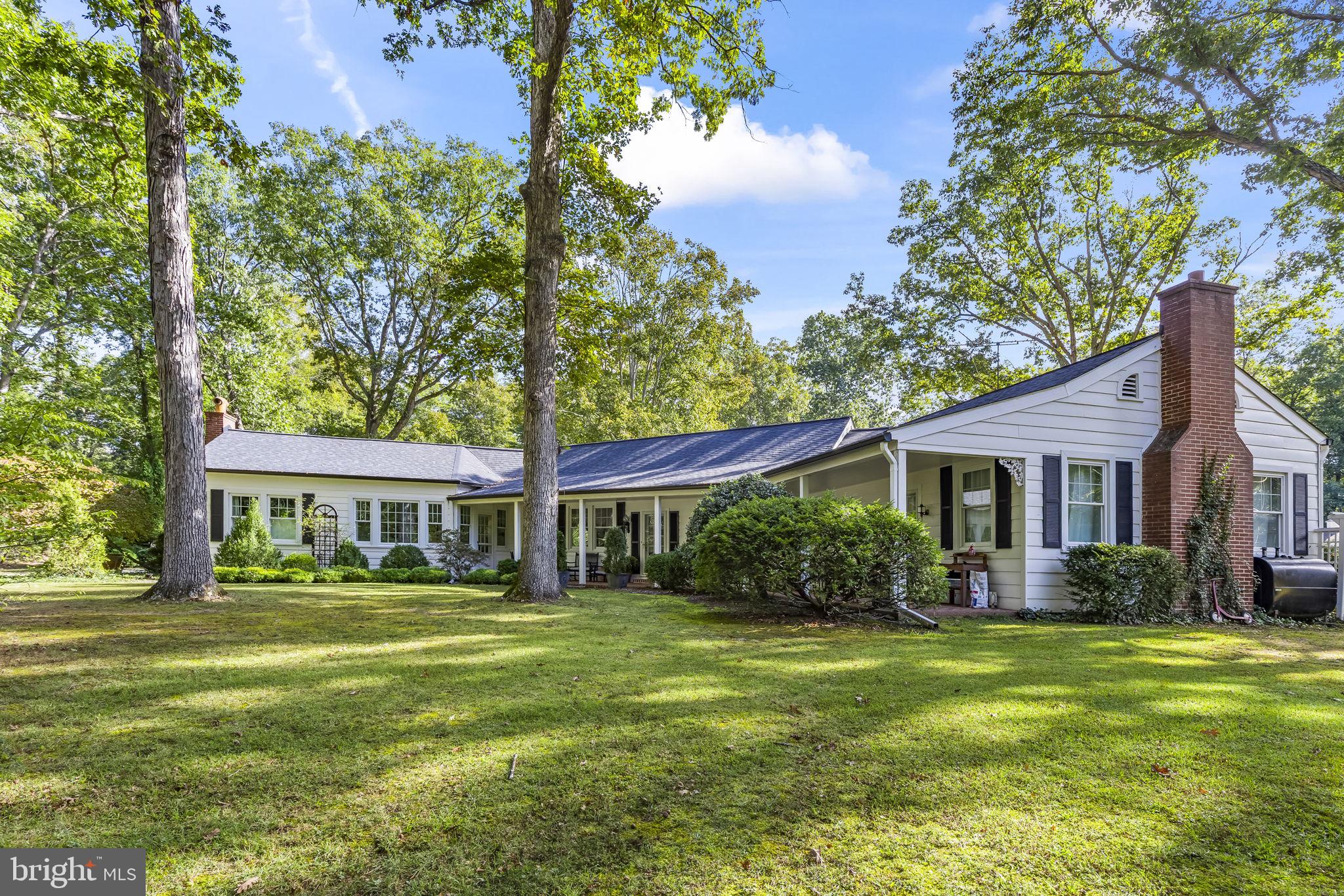 8150 Fairground Road La Plata, MD 20646 - Photo 8 of 100 a front view of a house with garden and trees