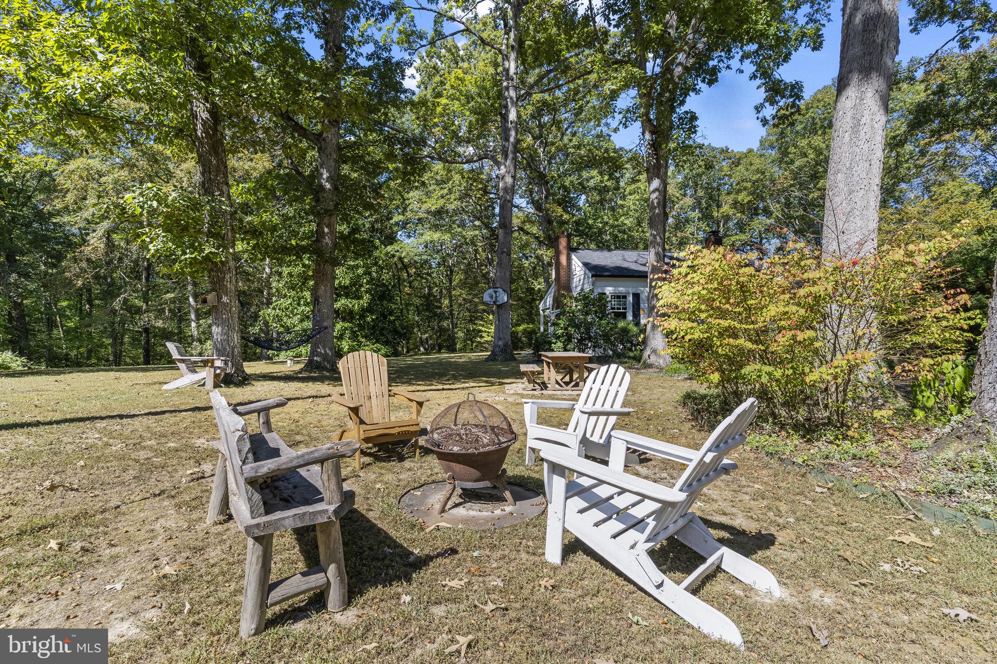 8150 Fairground Road La Plata, MD 20646 - Photo 91 of 100 a view of backyard with seating space and trees
