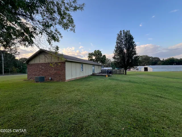 a backyard of a house with lots of green space