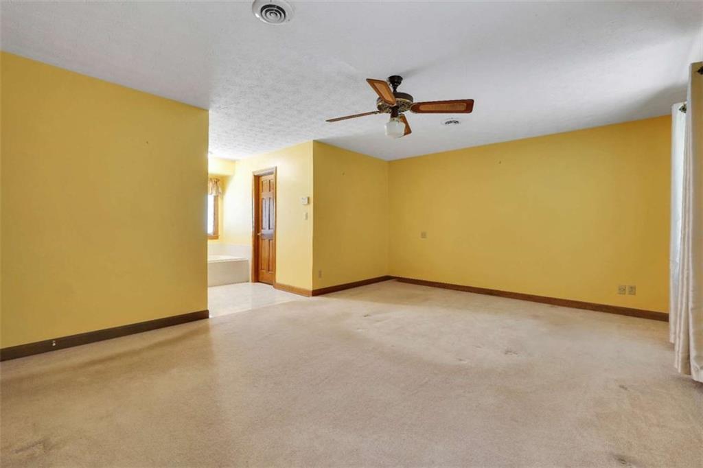 314 Winding Stream Trail Southwest Conyers, GA 30094 - Photo 25 of 59 a view of empty room with ceiling fan