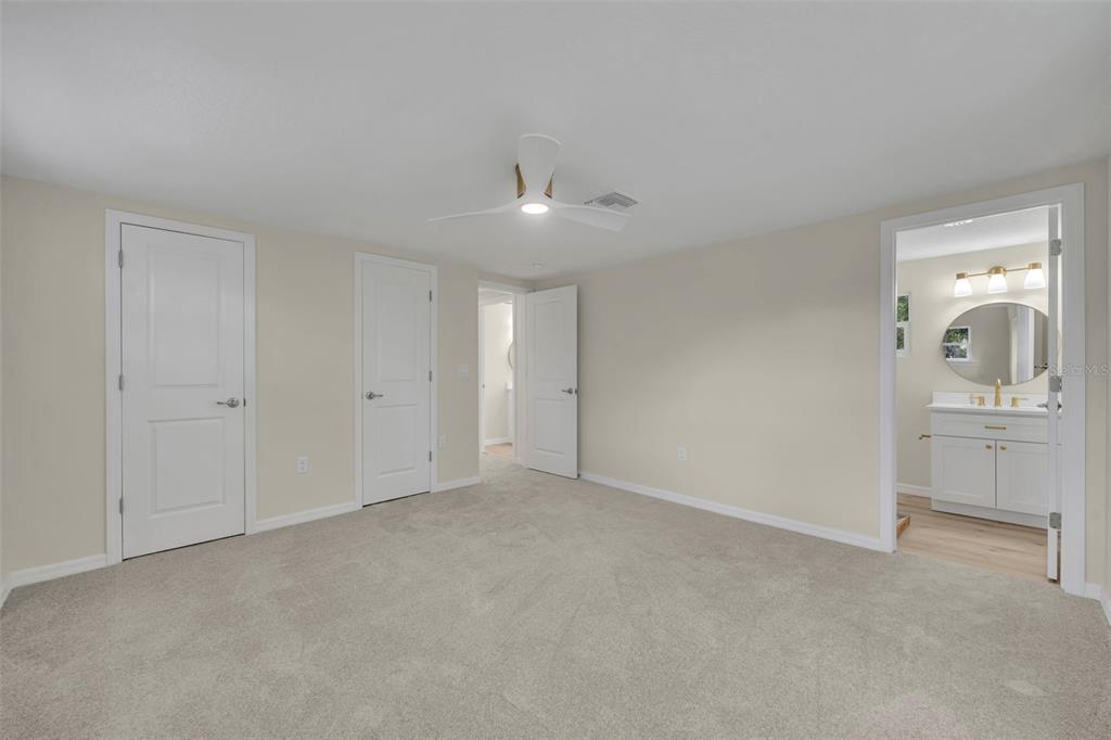 31201 Merry Road Tavares, FL 32778 - Photo 30 of 40 a view of a livingroom with a kitchen