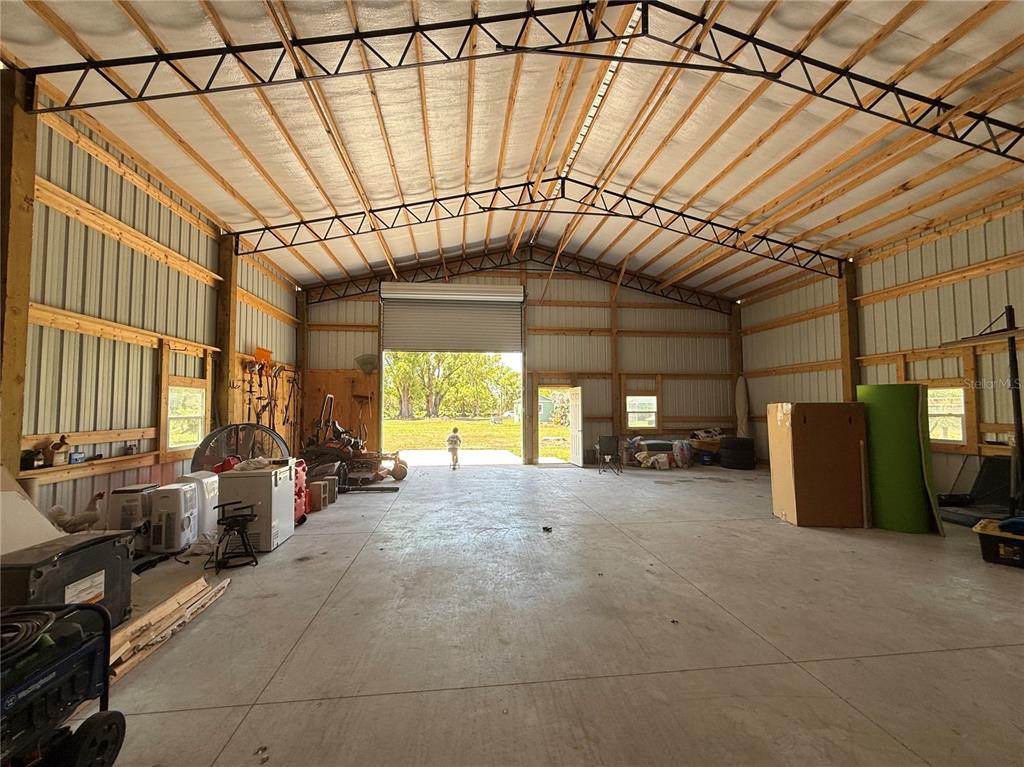 3535 Moores Lake Road Dover, FL 33527 - Photo 65 of 85 40x60 Garage Workshop - The two 14' tall roll-up doors create a DRIVE-THROUGH!