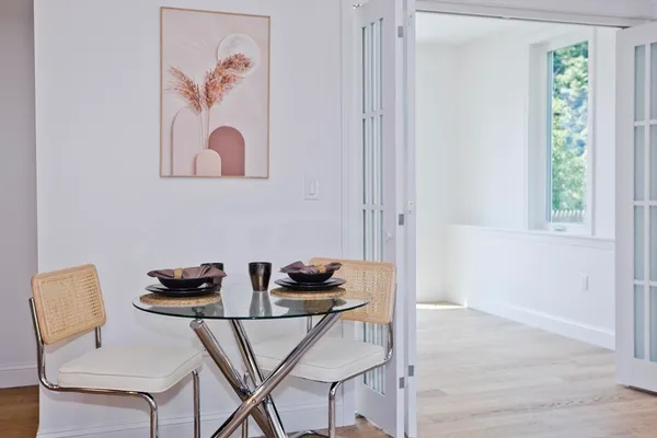 a view of a workspace with furniture and window