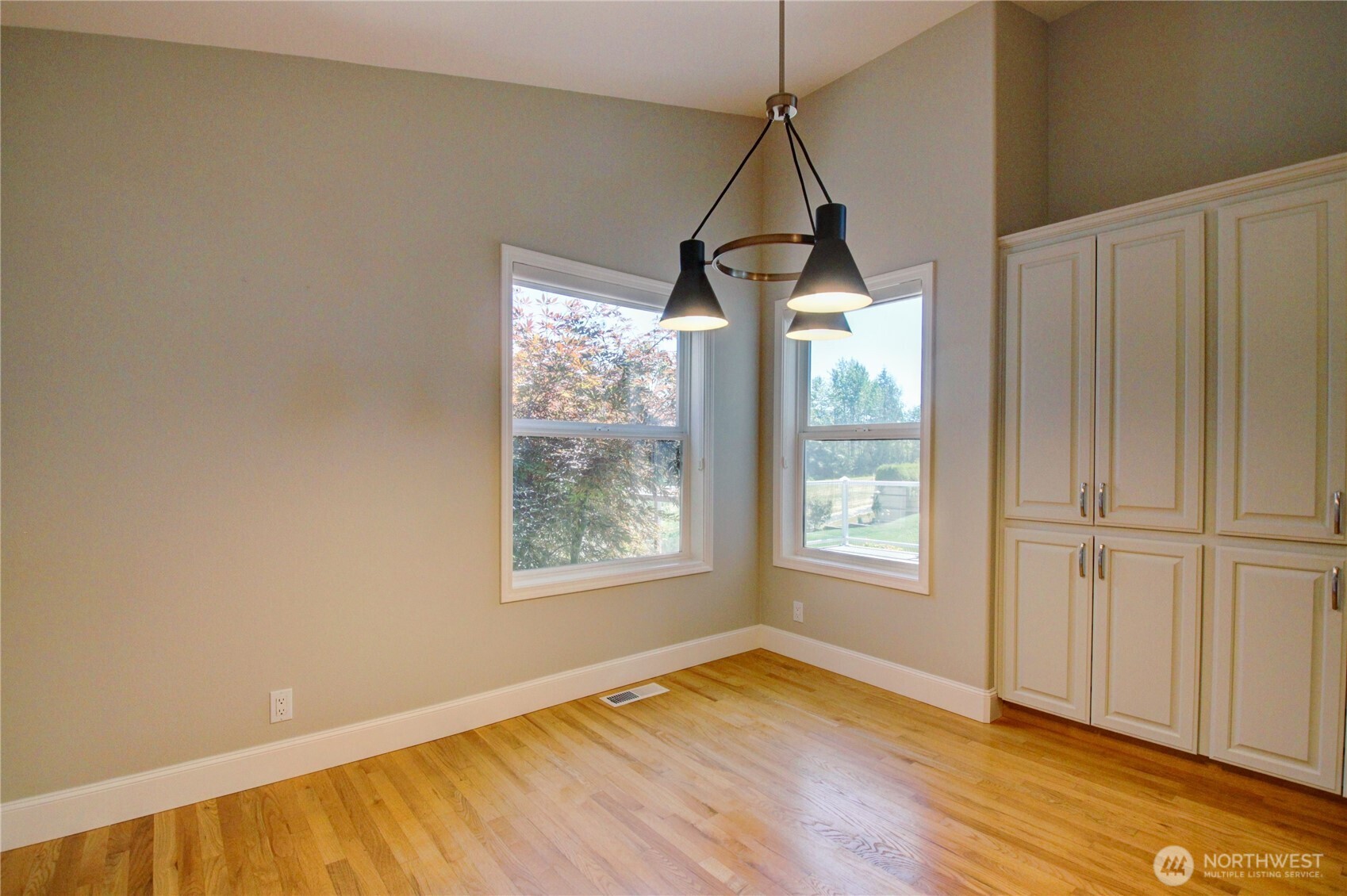 1408 Alpine View Place, Unit 2D Mount Vernon, WA 98274 - Photo 12 of 40 a view of empty room with wooden floor and fan