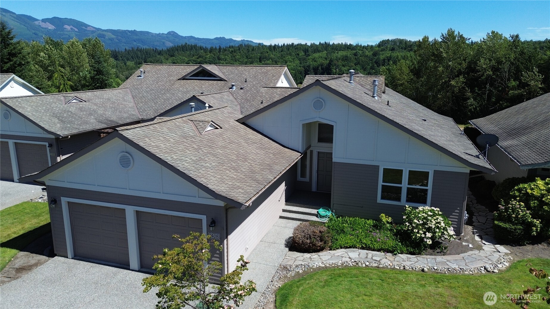 1408 Alpine View Place, Unit 2D Mount Vernon, WA 98274 - Photo 2 of 40 a aerial view of a house with a yard and potted plants