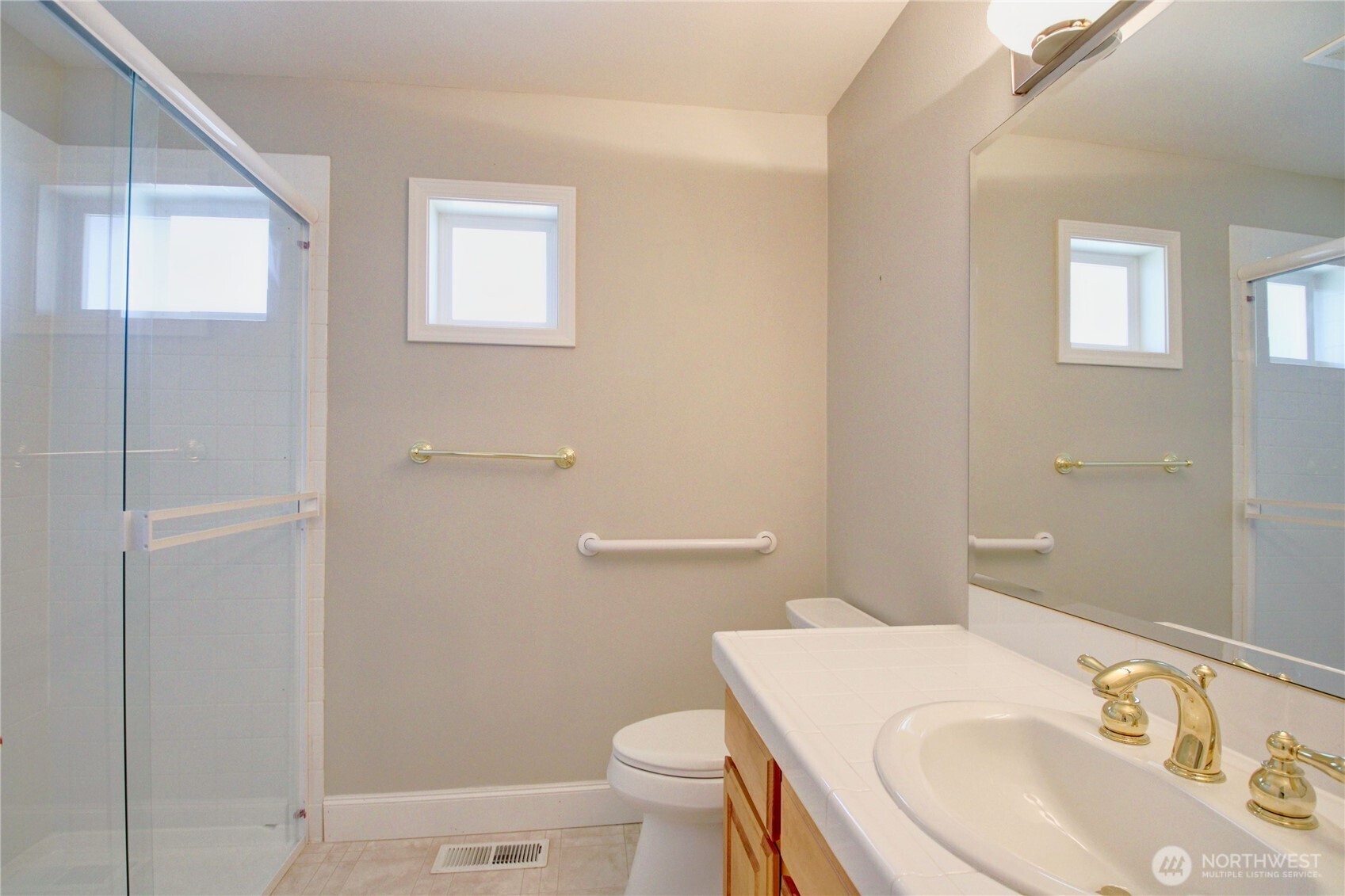 1408 Alpine View Place, Unit 2D Mount Vernon, WA 98274 - Photo 29 of 40 a bathroom with a sink a toilet and vanity