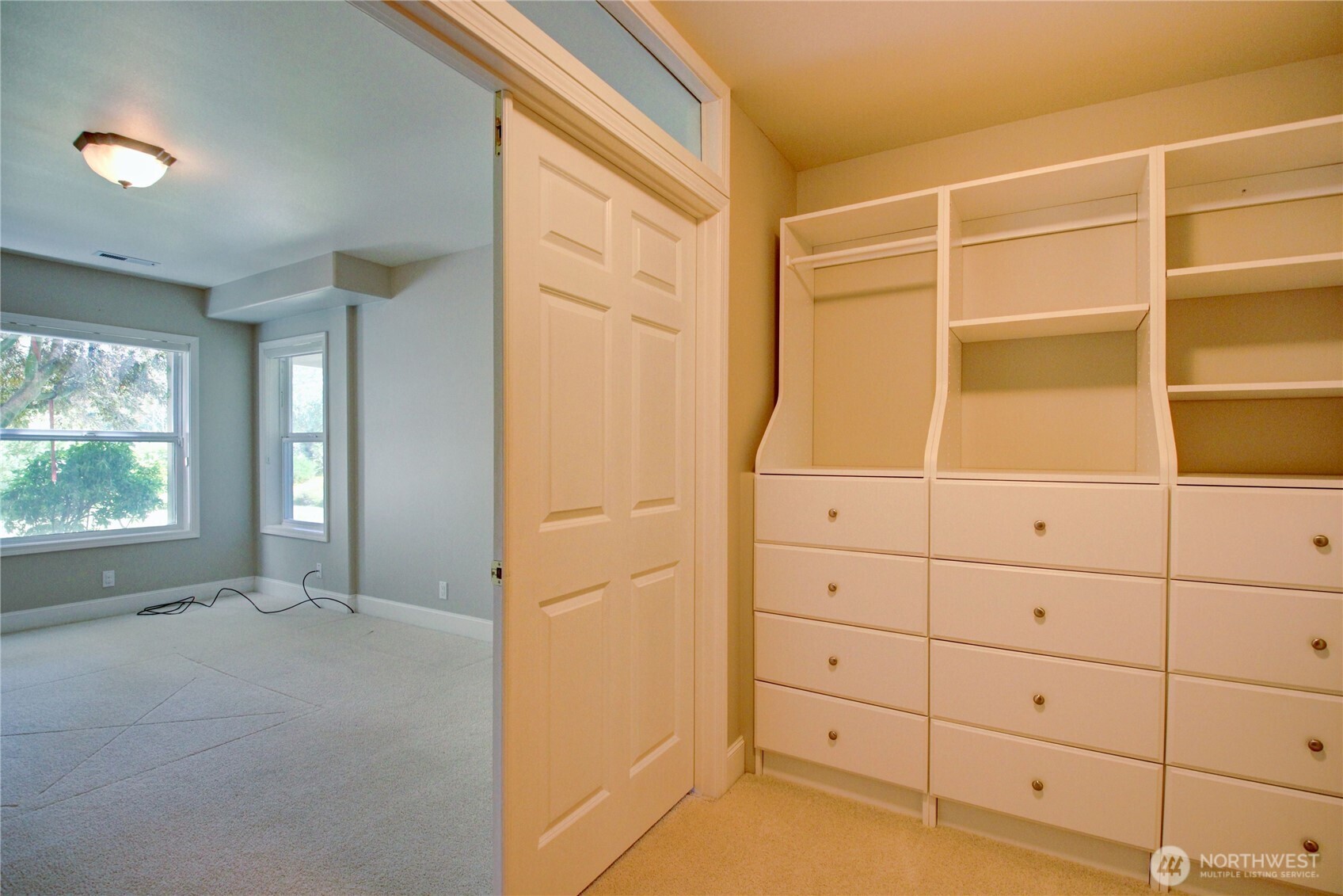1408 Alpine View Place, Unit 2D Mount Vernon, WA 98274 - Photo 36 of 40 a view of an empty room with wooden floor and cabinet