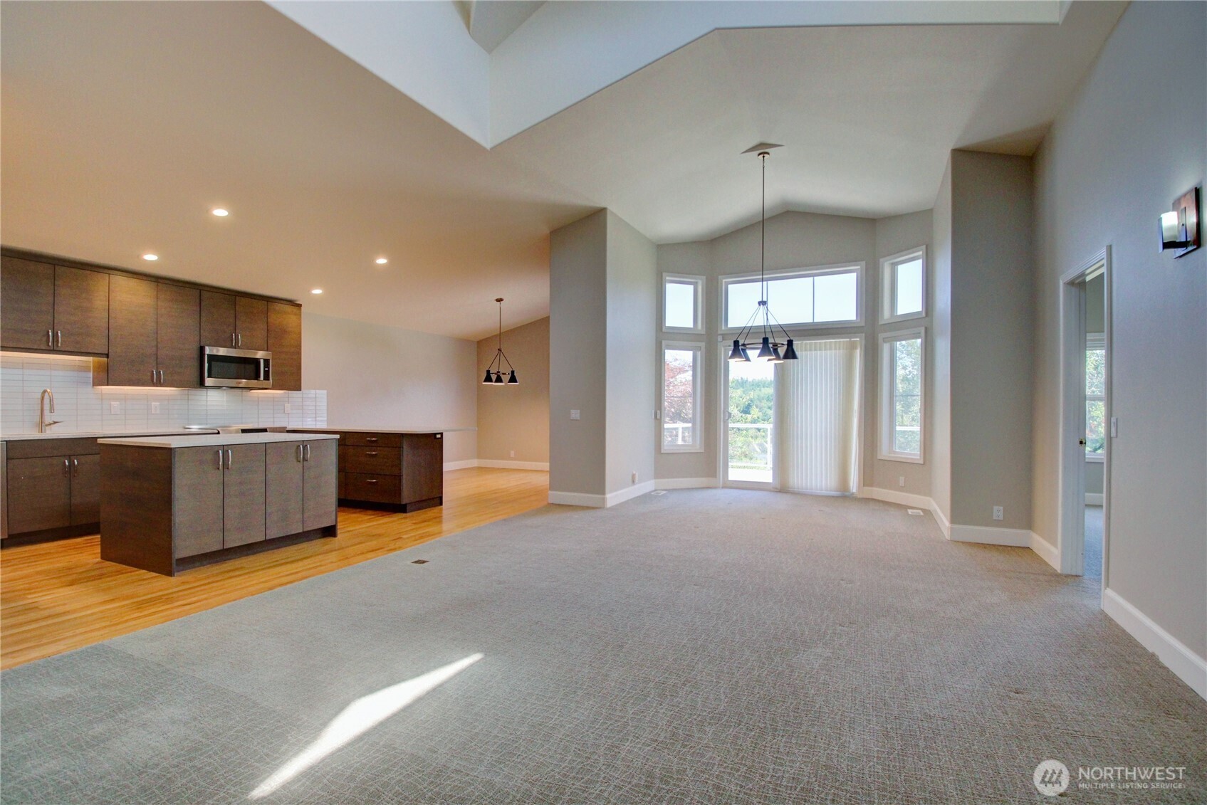 1408 Alpine View Place, Unit 2D Mount Vernon, WA 98274 - Photo 8 of 40 a view of a kitchen with a sink and a refrigerator
