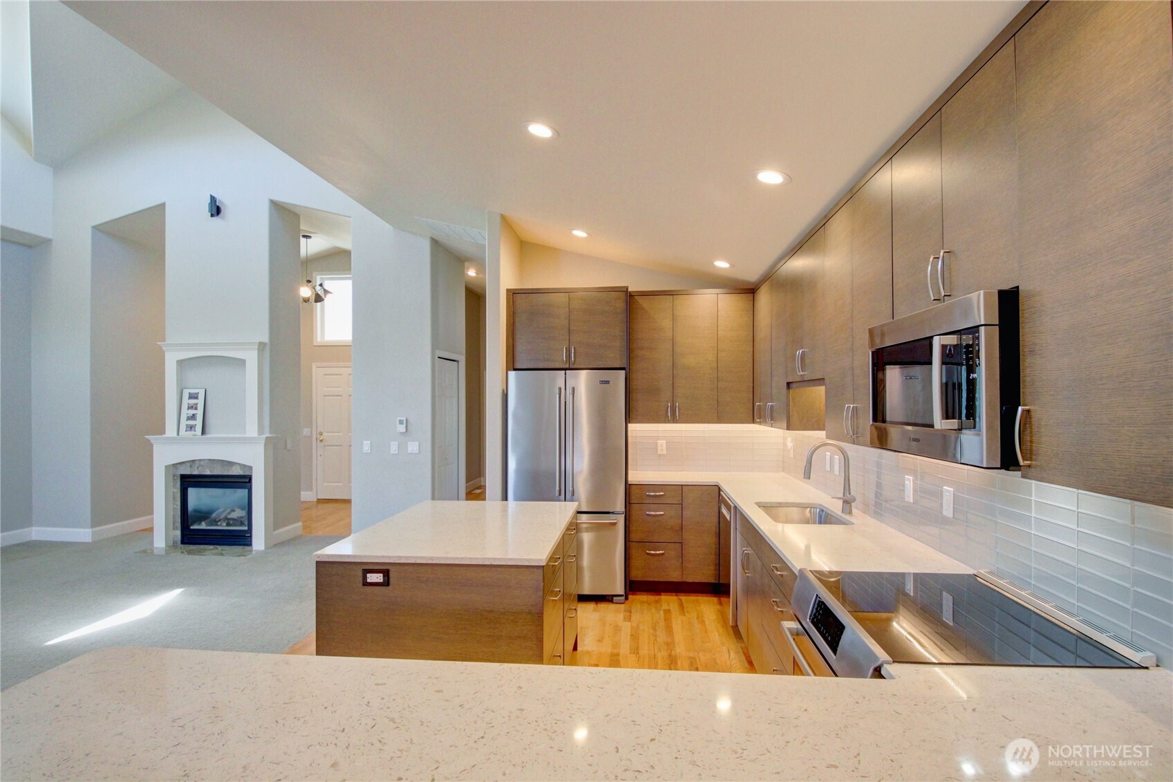 1408 Alpine View Place, Unit 2D Mount Vernon, WA 98274 - Photo 10 of 40 a living room with stainless steel appliances kitchen island furniture and a kitchen view