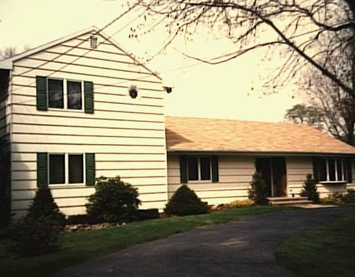 92 Purdy Hill Road Monroe, CT 06468 - Photo 1 of 1 a front view of a house with a yard and garage