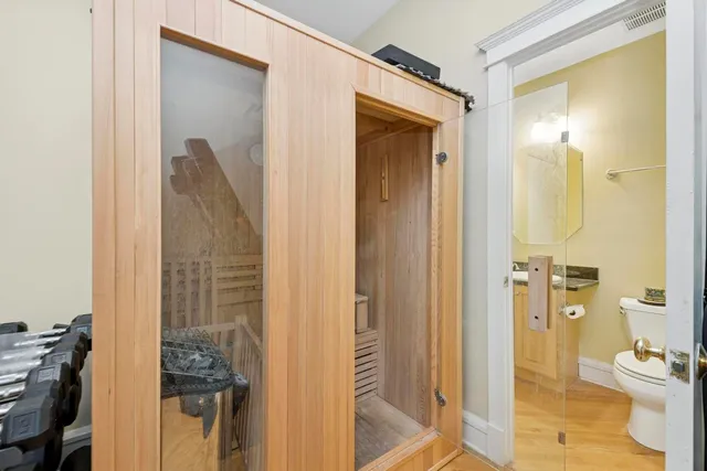 a bathroom with a shower and a sink