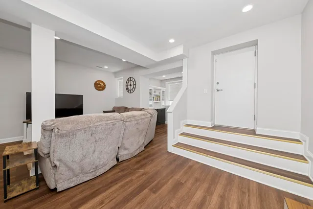 a bedroom with a bed and a ceiling fan