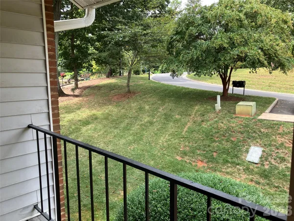 a view of a garden from a balcony