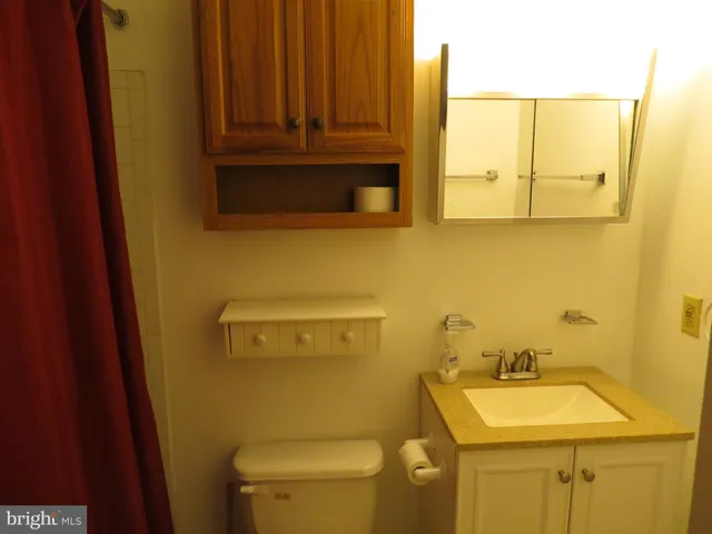 a bathroom with a toilet and a sink