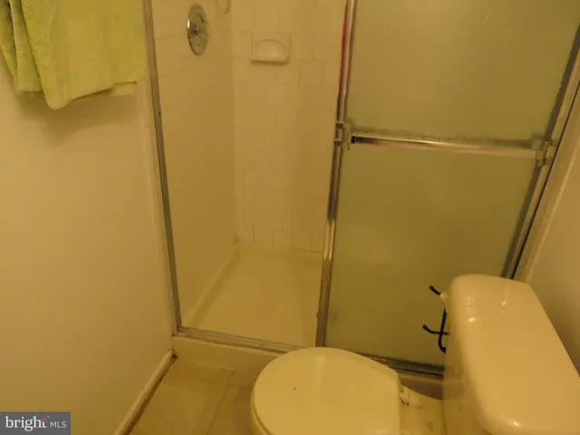 a bathroom with a sink toilet and mirror