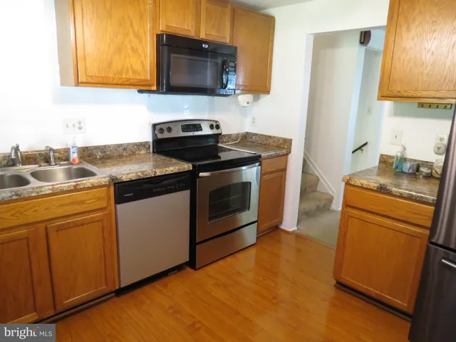 a view of a livingroom with a ceiling fan and a window