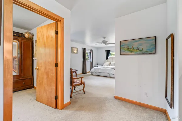 a view of a bedroom with a furniture and bed