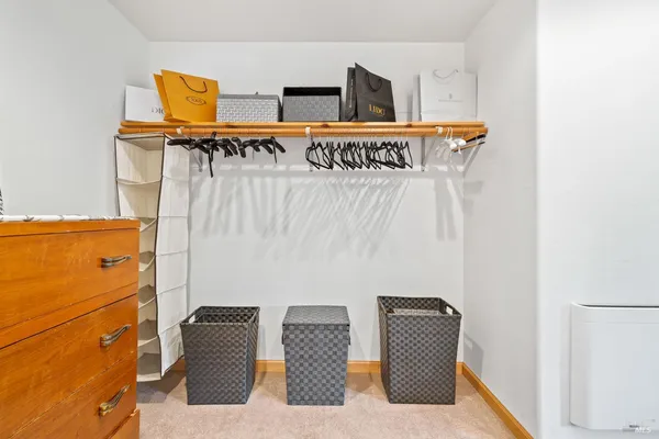 a walk in closet with window