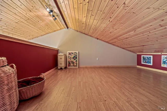 a view of outdoor space with wooden floor