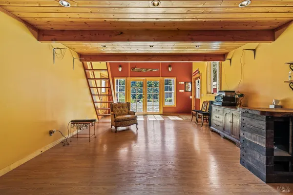 a lobby with furniture and floor to ceiling window