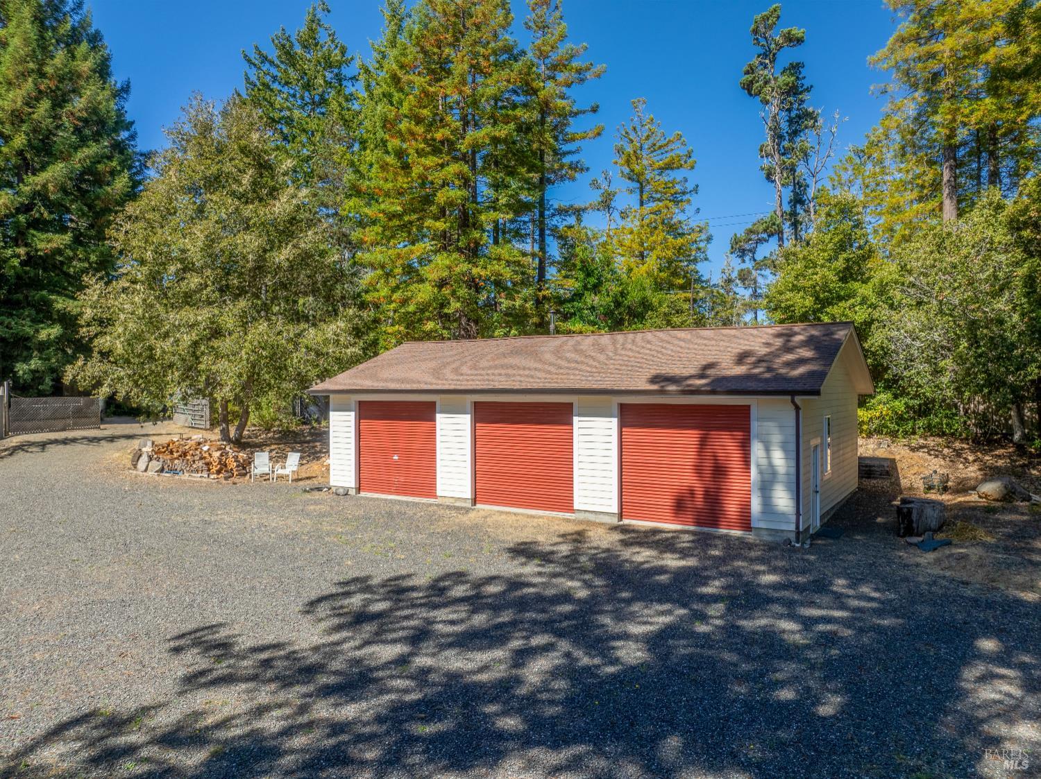 31026 Albion Ridge L Road Albion, CA 95410 - Photo 32 of 40 a front view of a house with a yard and garage