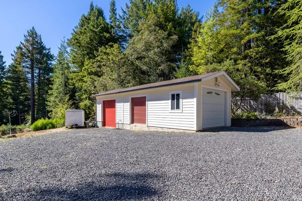 a view of house with a deck