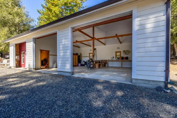 a view of a house with a yard and garage
