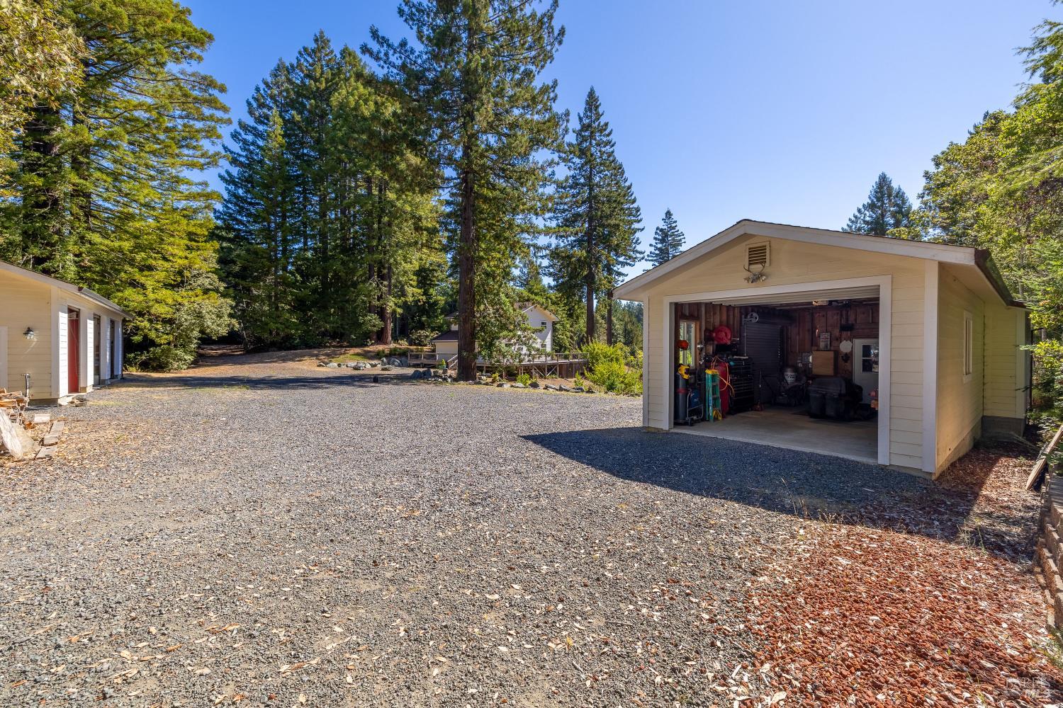 31026 Albion Ridge L Road Albion, CA 95410 - Photo 37 of 40 a view of a house with a yard and garage