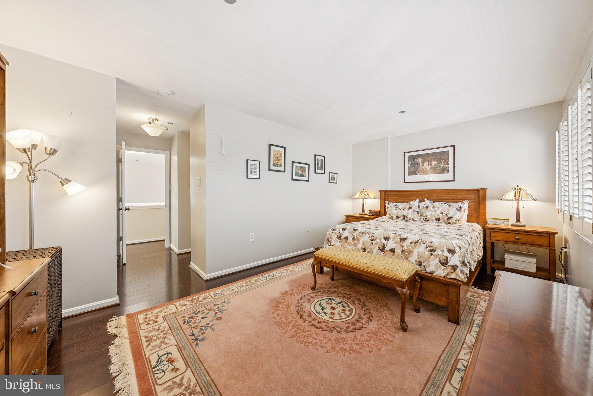 1301 North Courthouse Road, Unit 1810 Arlington, VA 22201 - Photo 14 of 29 a bedroom with a bed and a table in it