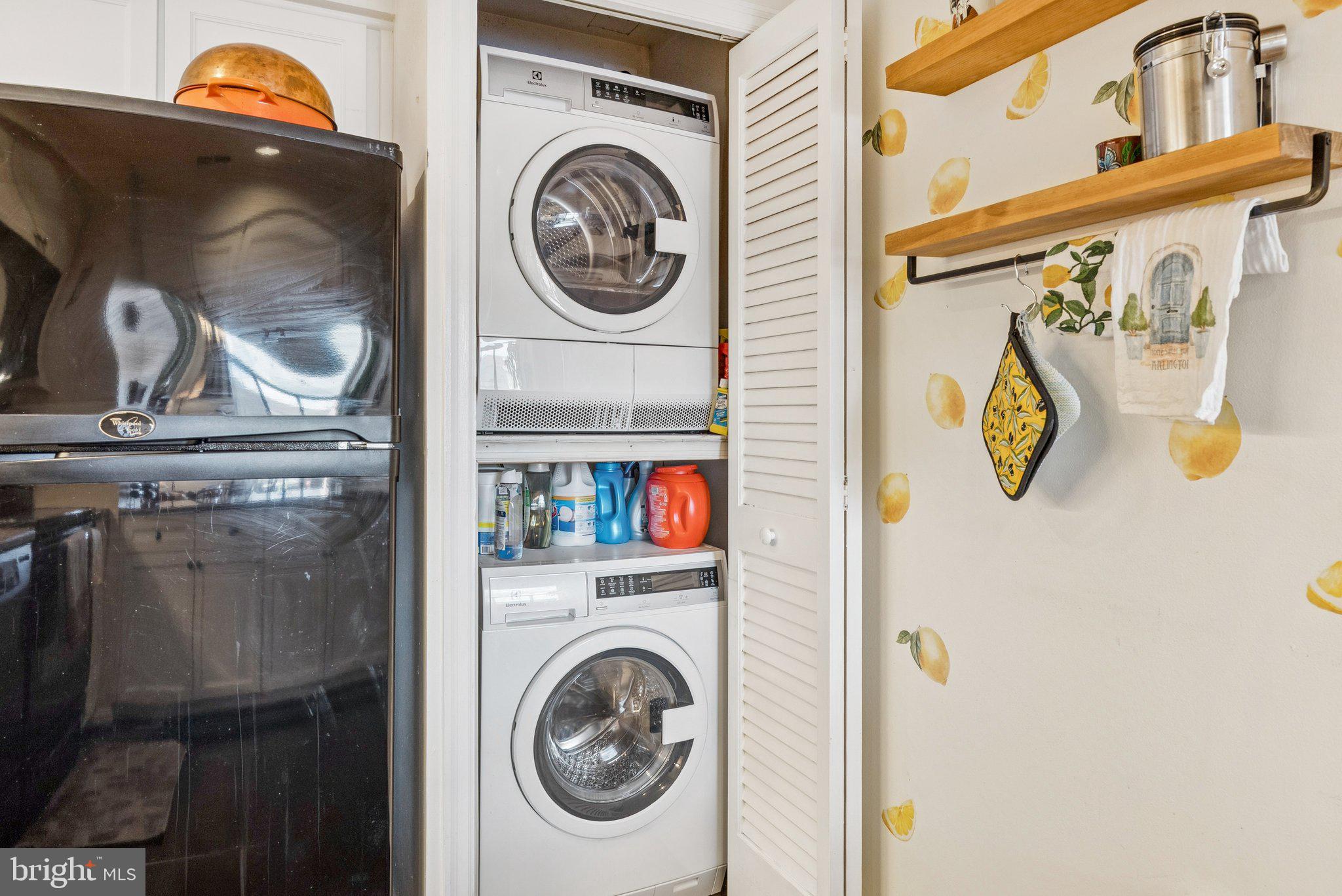 1301 North Courthouse Road, Unit 1810 Arlington, VA 22201 - Photo 17 of 29 a utility room with dryer and washer