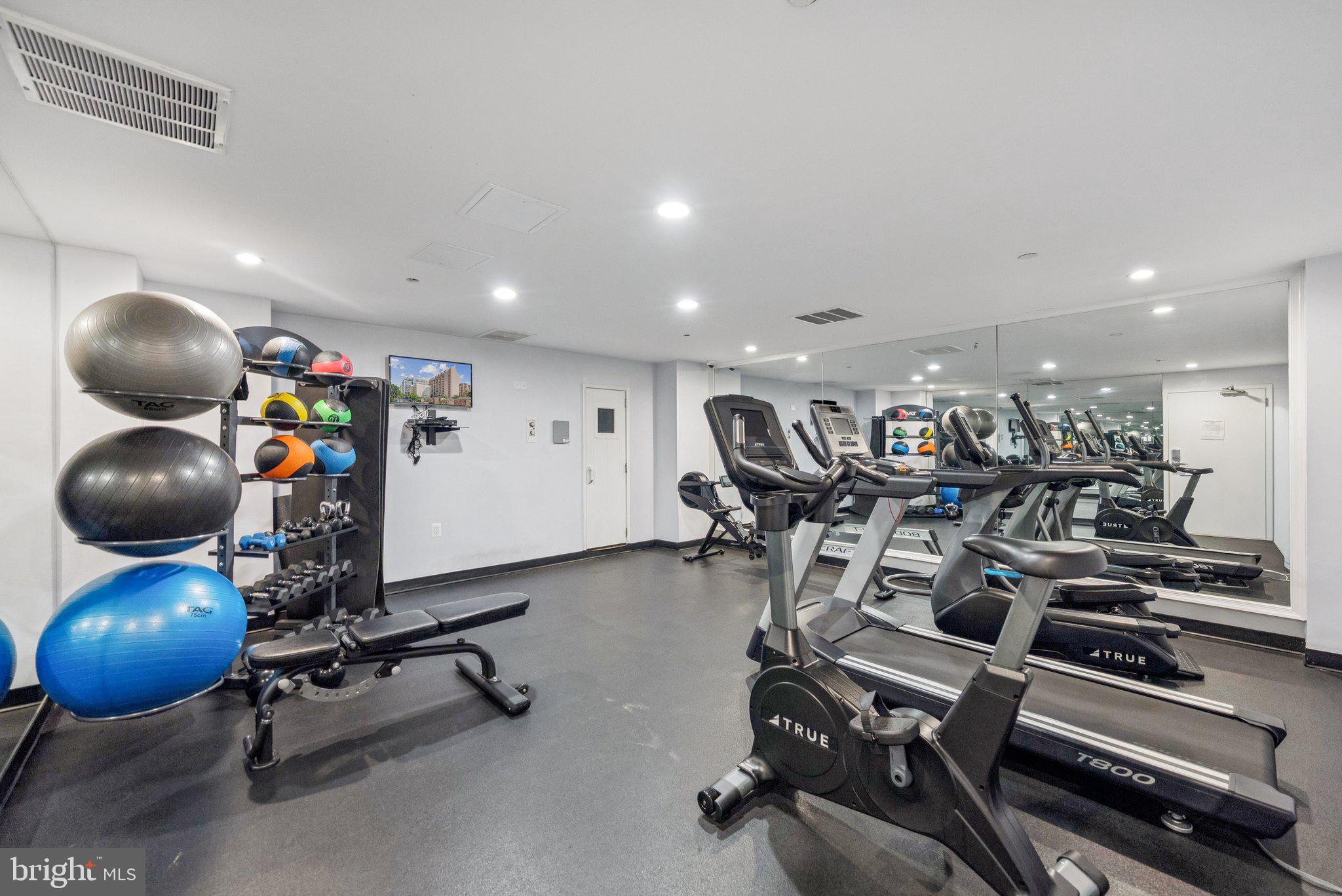 1301 North Courthouse Road, Unit 1810 Arlington, VA 22201 - Photo 27 of 29 a view of a room with gym equipment