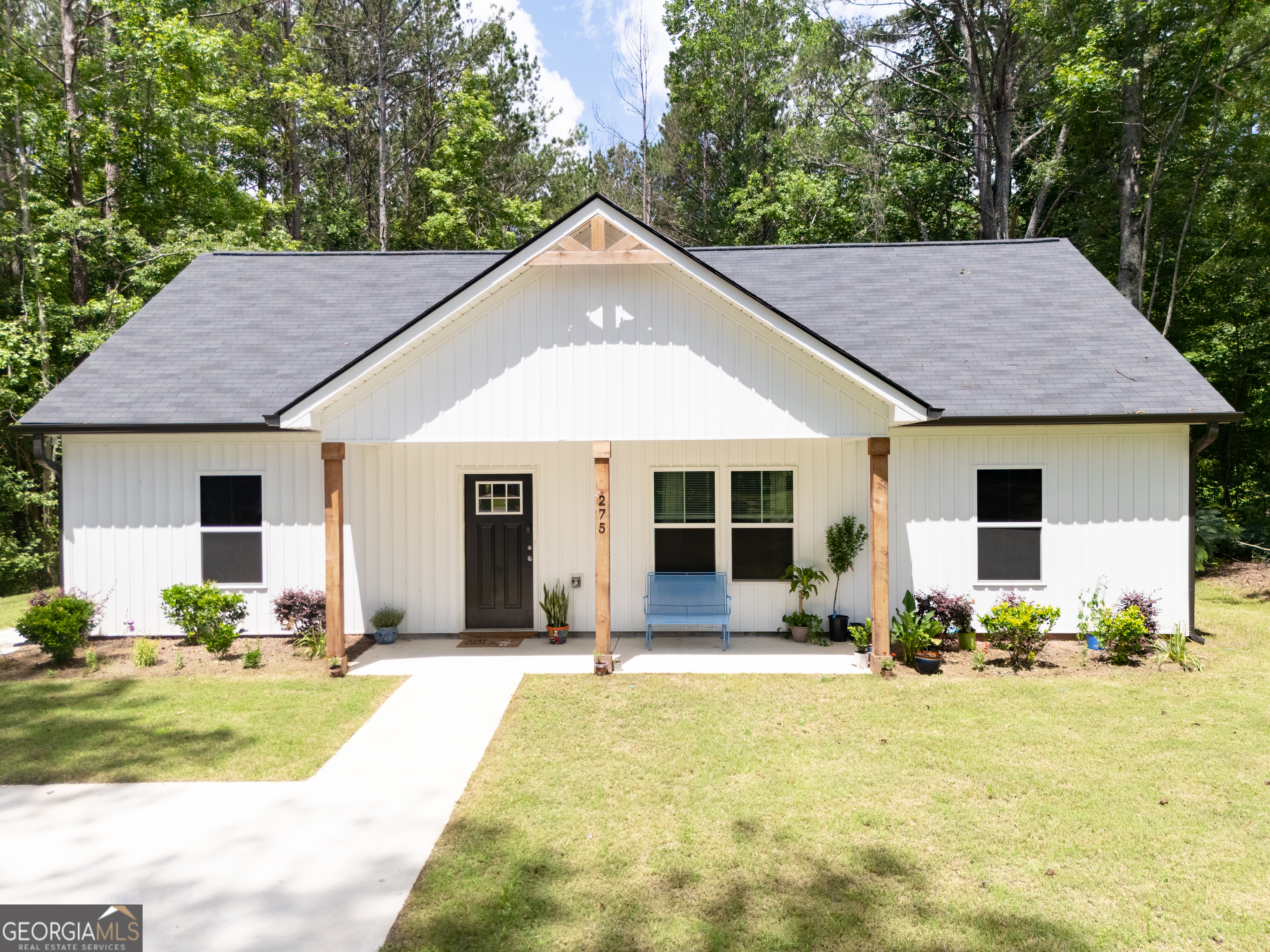 275 Bethlehem Church Road Carrollton, GA 30117 - Photo 1 of 1 a front view of house with yard outdoor seating and barbeque oven