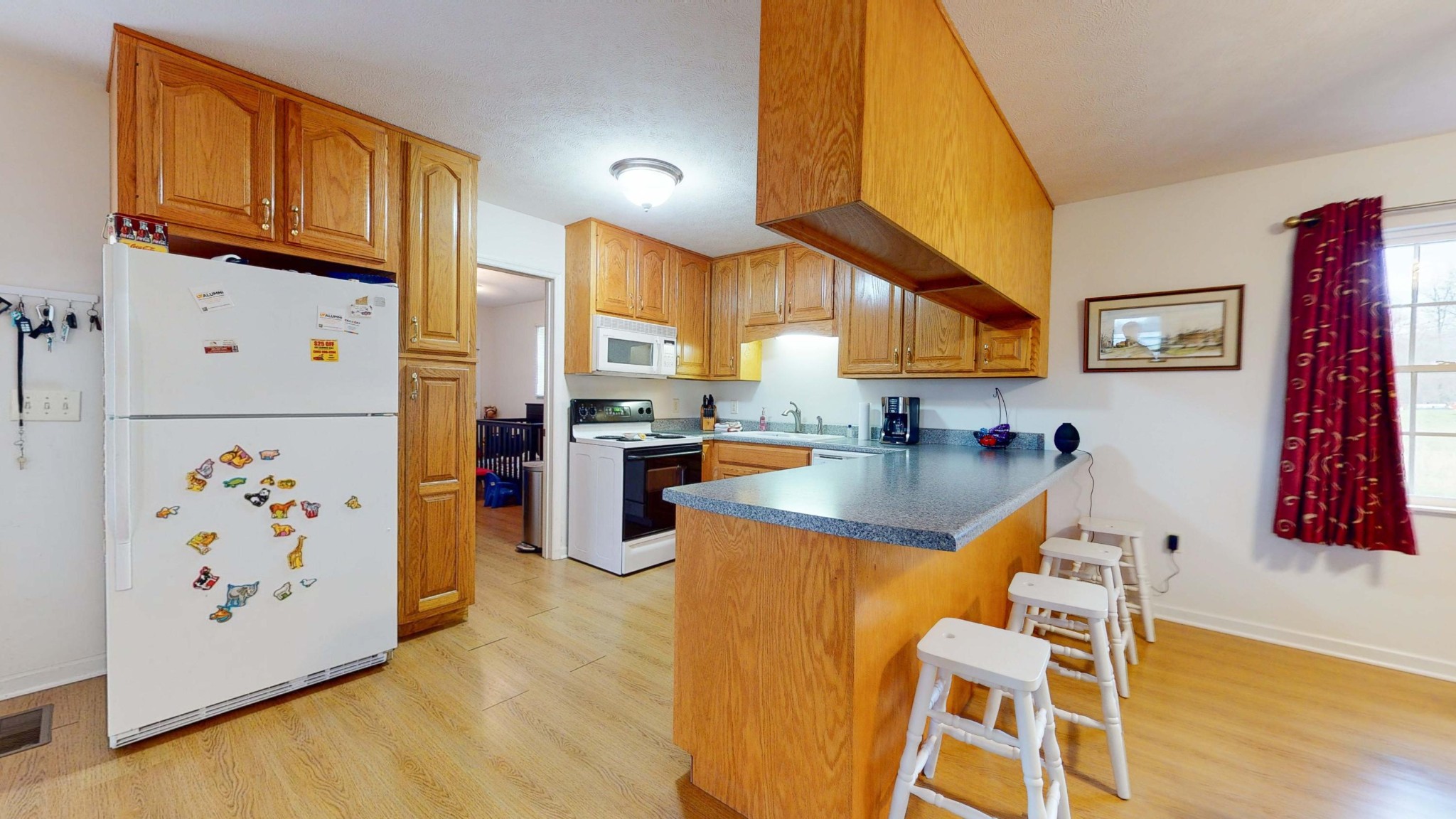 175 Accommodation Road Blaine, TN 37709 - Photo 8 of 30 a kitchen with stainless steel appliances granite countertop a refrigerator a stove and a wooden cabinets