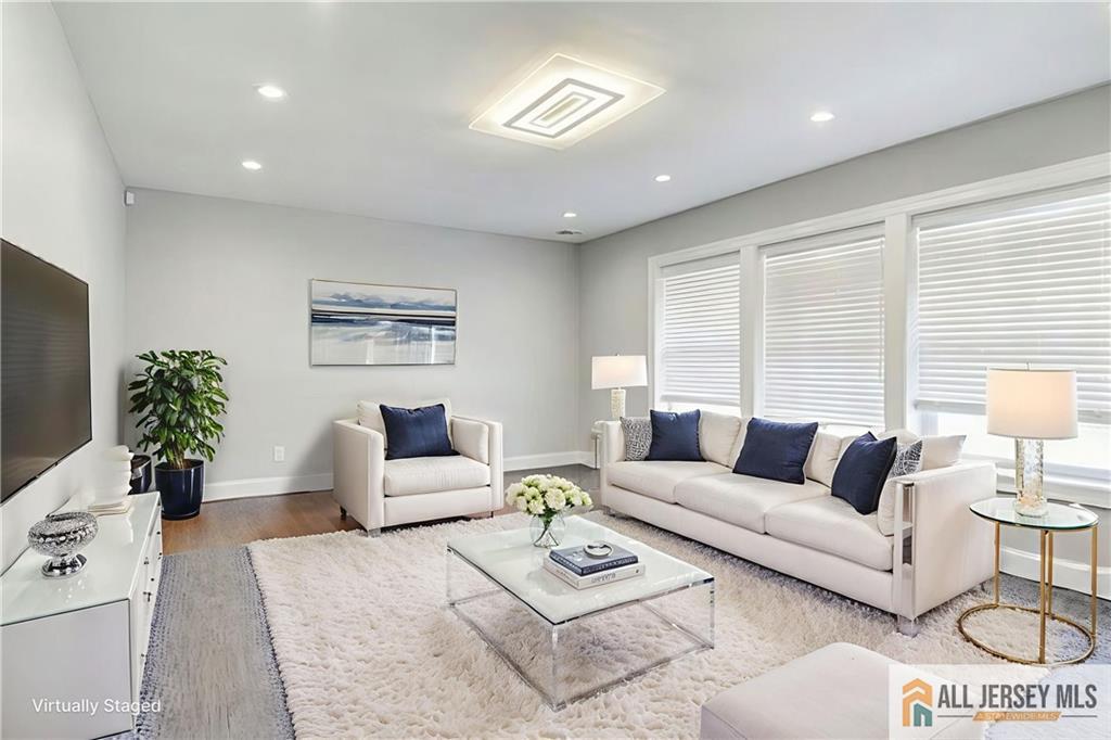 176 Old Forge Road Monroe Township, NJ 08831 - Photo 13 of 36 a living room with furniture and a large window
