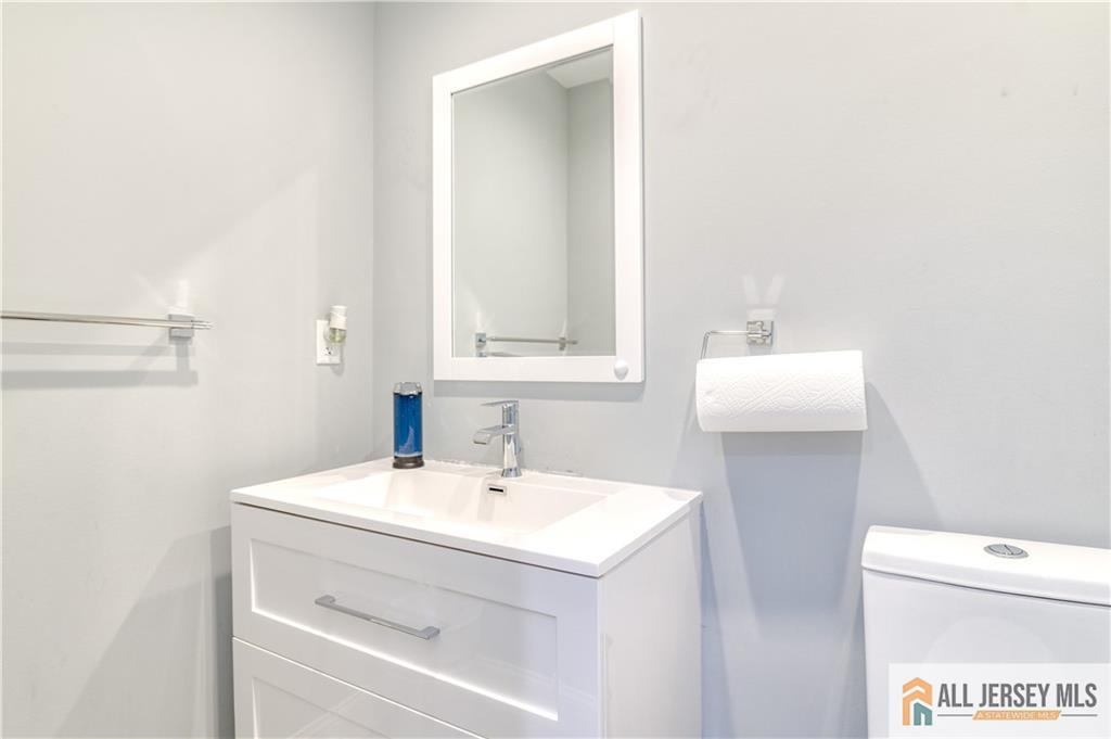 176 Old Forge Road Monroe Township, NJ 08831 - Photo 16 of 36 a bathroom with a sink and a toilet