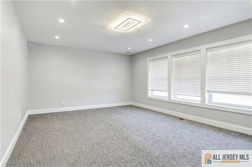 176 Old Forge Road Monroe Township, NJ 08831 - Photo 18 of 36 an empty room with a window