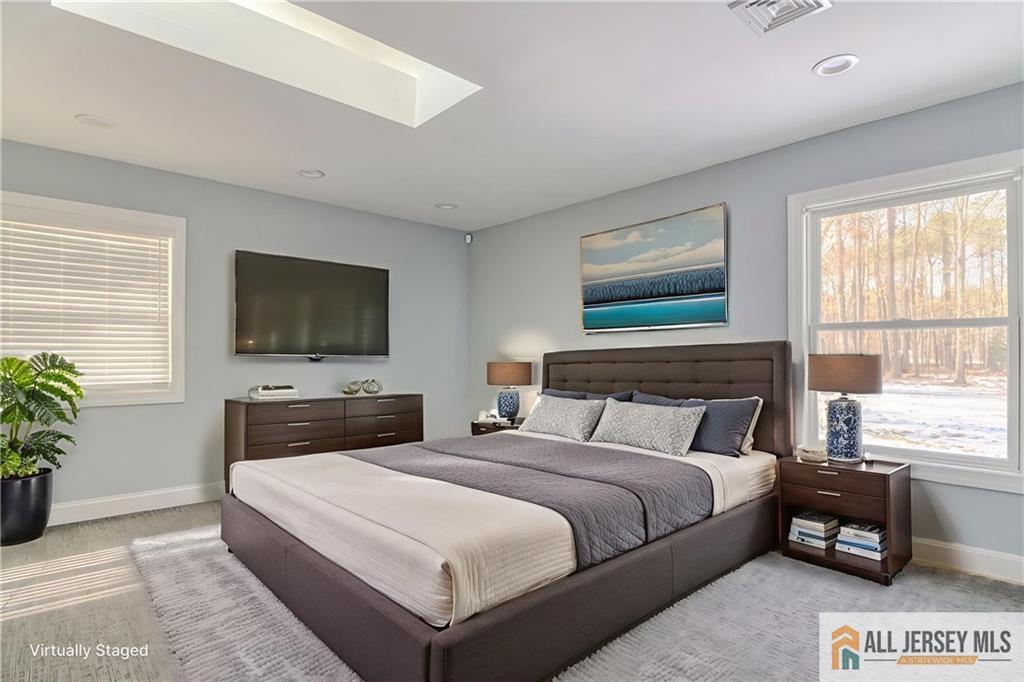 176 Old Forge Road Monroe Township, NJ 08831 - Photo 19 of 36 a bedroom with a large bed and a flat screen tv