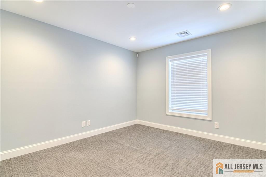 176 Old Forge Road Monroe Township, NJ 08831 - Photo 20 of 36 an empty room with a window