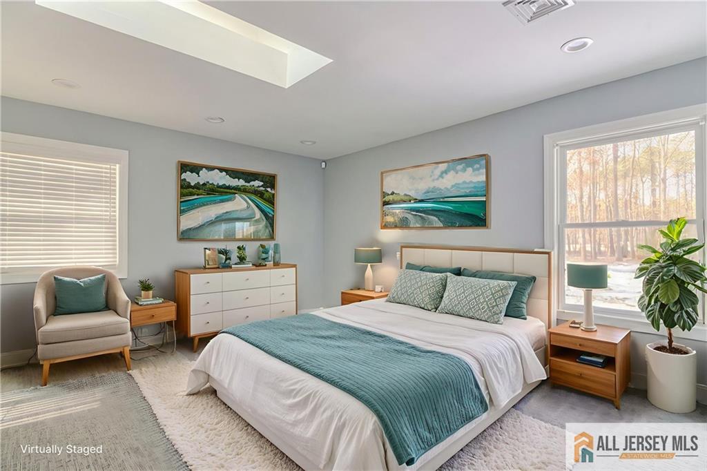 176 Old Forge Road Monroe Township, NJ 08831 - Photo 21 of 36 a bedroom with a bed and a couch