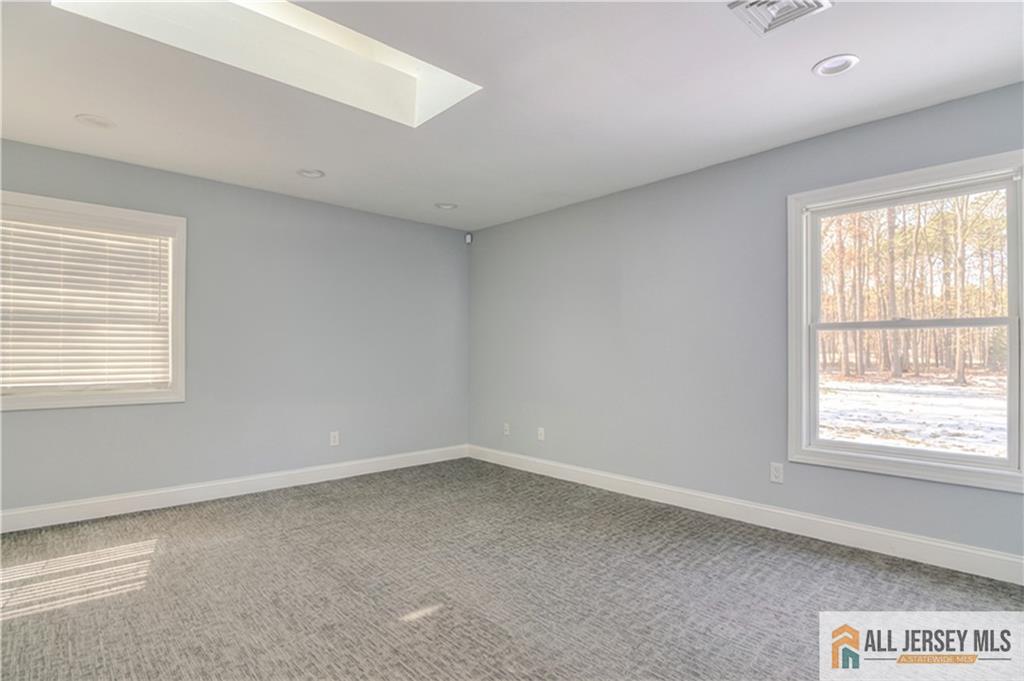 176 Old Forge Road Monroe Township, NJ 08831 - Photo 22 of 36 an empty room with a window
