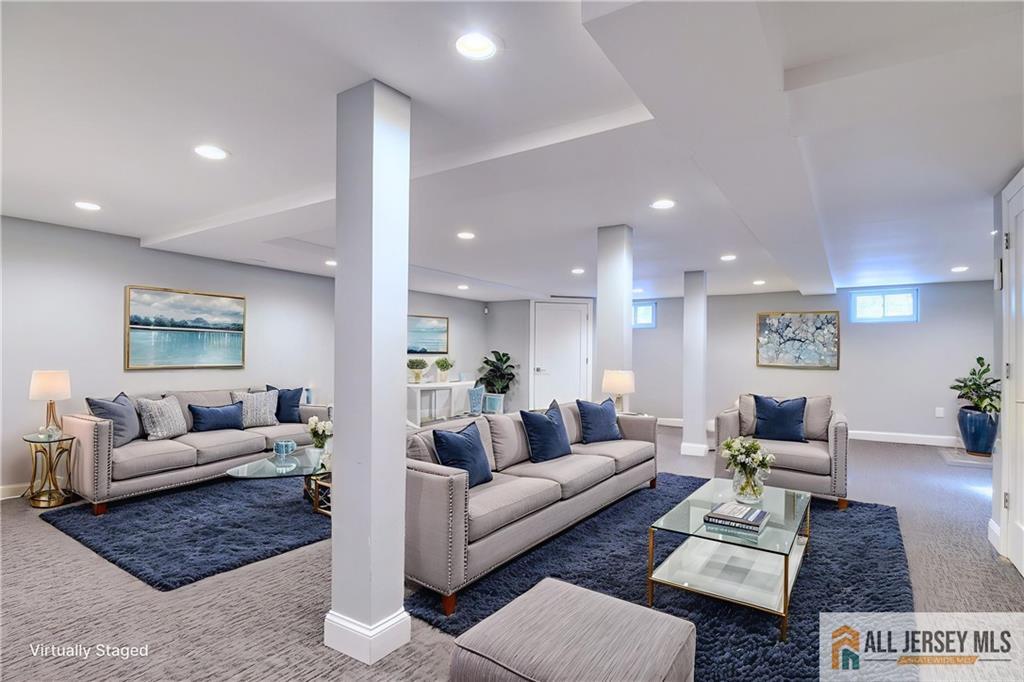 176 Old Forge Road Monroe Township, NJ 08831 - Photo 27 of 36 a living room with furniture rug and a table