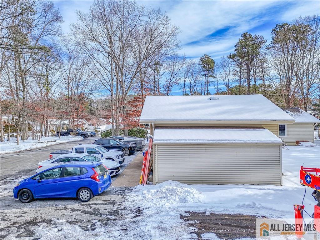 176 Old Forge Road Monroe Township, NJ 08831 - Photo 34 of 36 a red car parked in front of a house