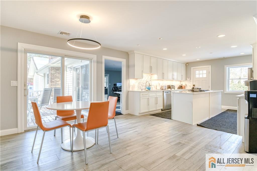 176 Old Forge Road Monroe Township, NJ 08831 - Photo 6 of 36 a view of kitchen with cabinets and wooden floor