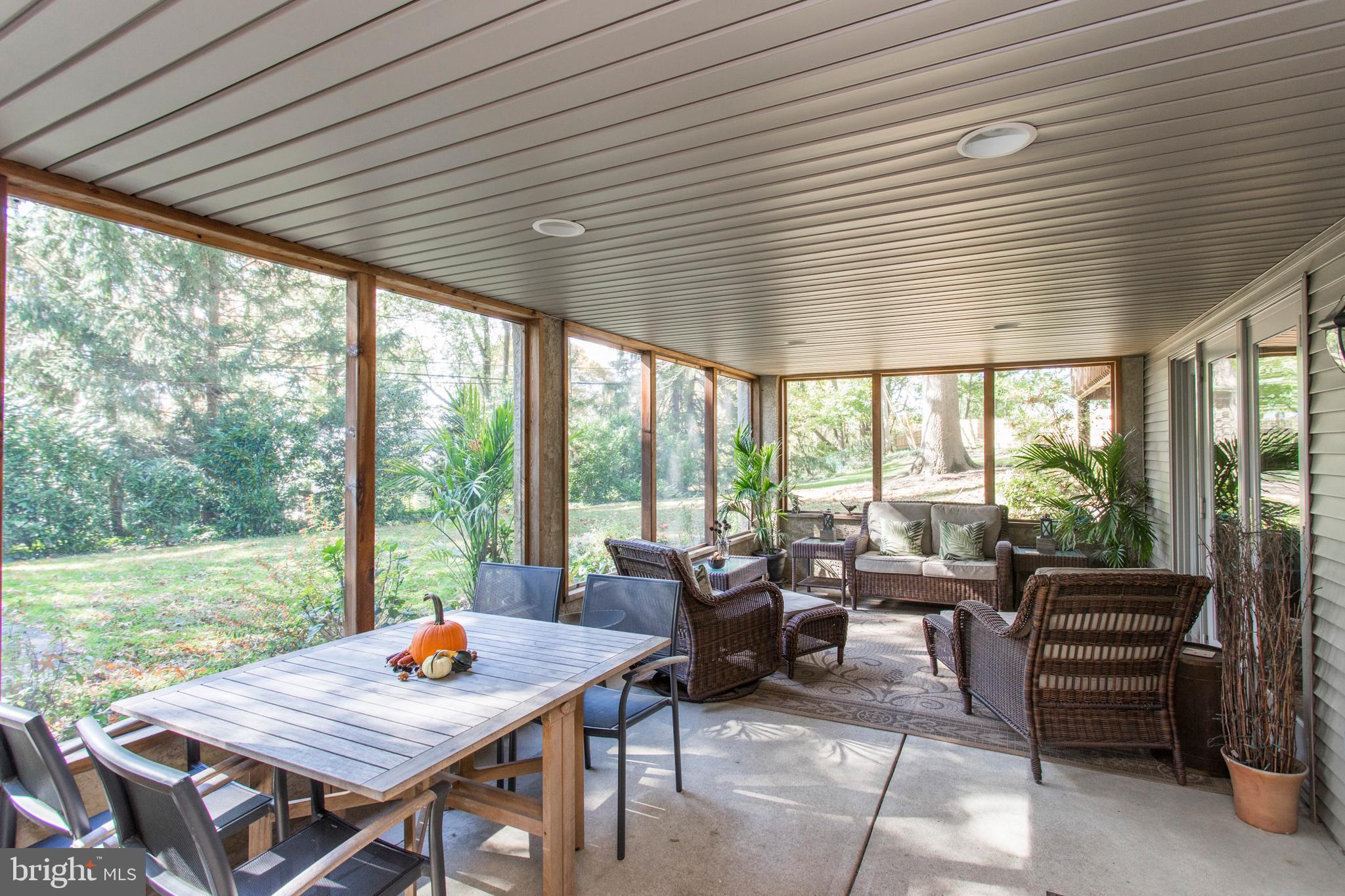 651 Church Road Flourtown, PA 19031 - Photo 24 of 29 Screened in porch with views of the yard.