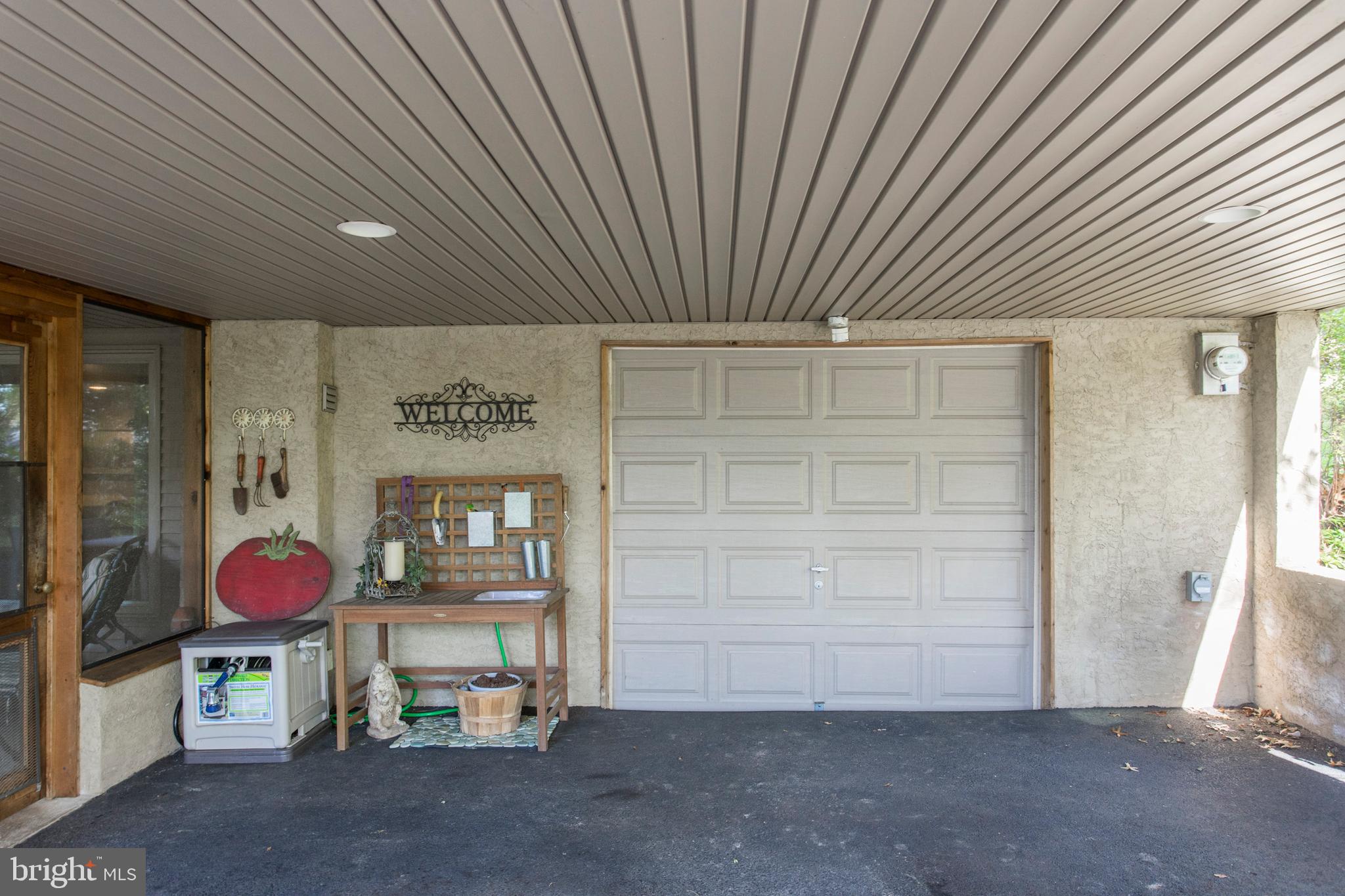 651 Church Road Flourtown, PA 19031 - Photo 25 of 29 One car garage and carport for two cars.