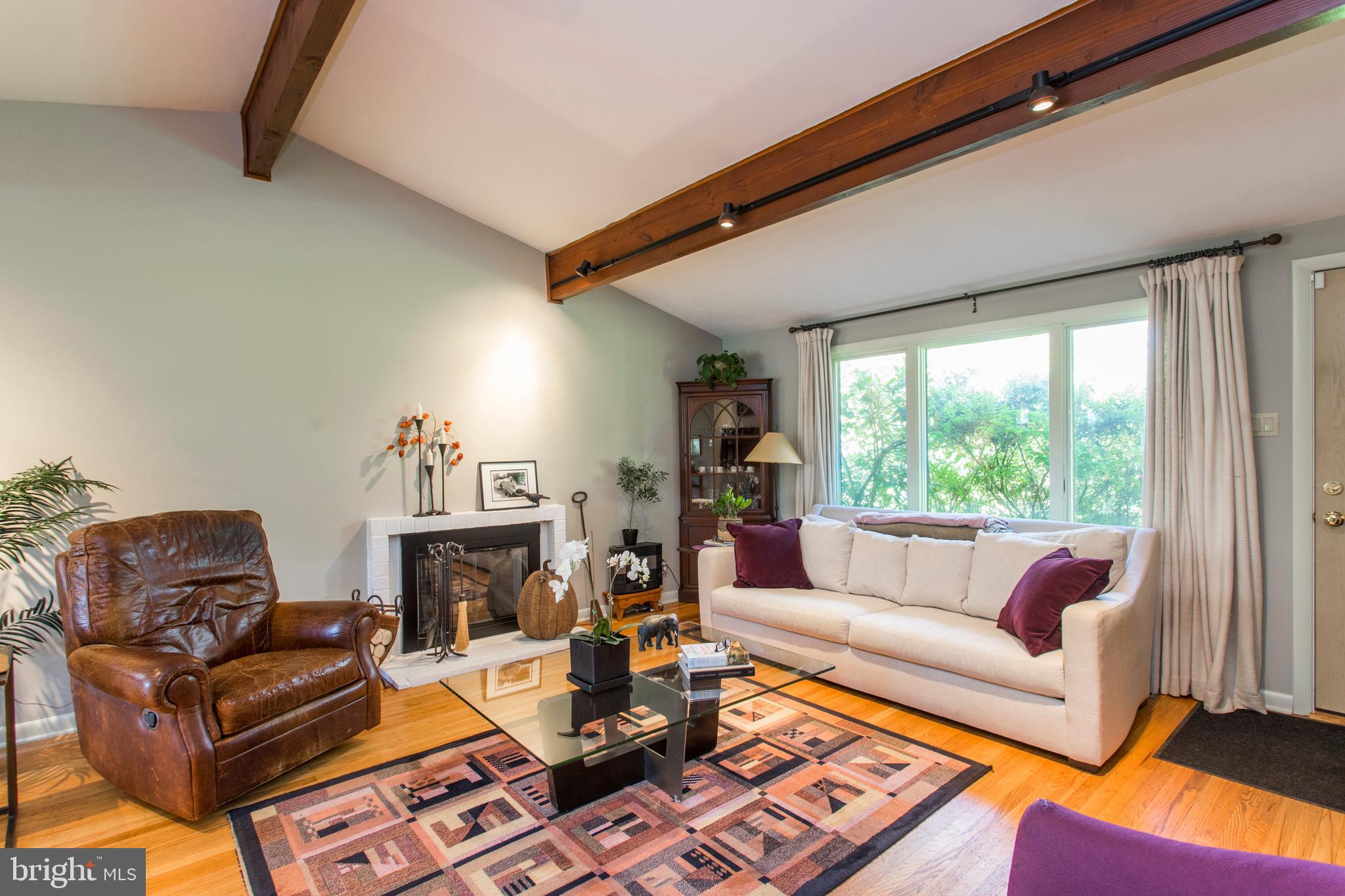 651 Church Road Flourtown, PA 19031 - Photo 6 of 29 Living Room with wooden beams and track lighting.